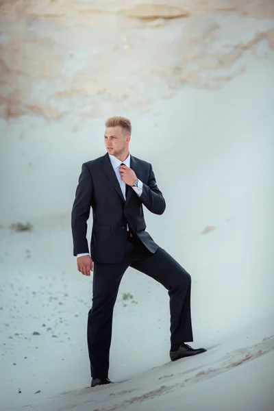 Young businessman in black suit — Stock Photo, Image