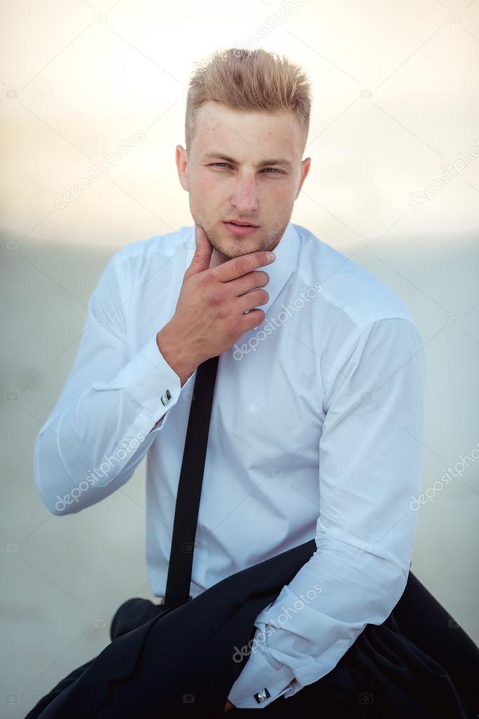 Young businessman posing outdoors