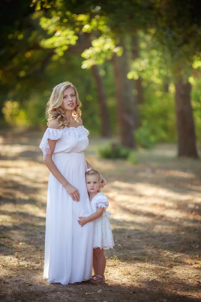 Pregnant woman with daughter — Stock Photo, Image