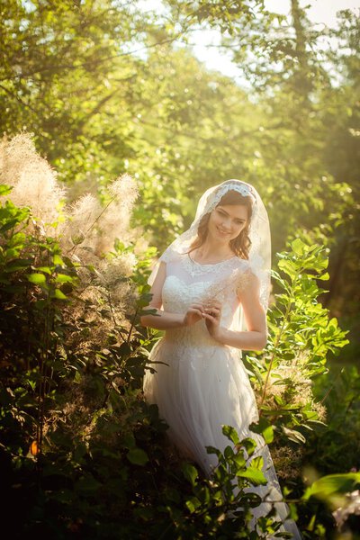 Bride in white dress in the garden
