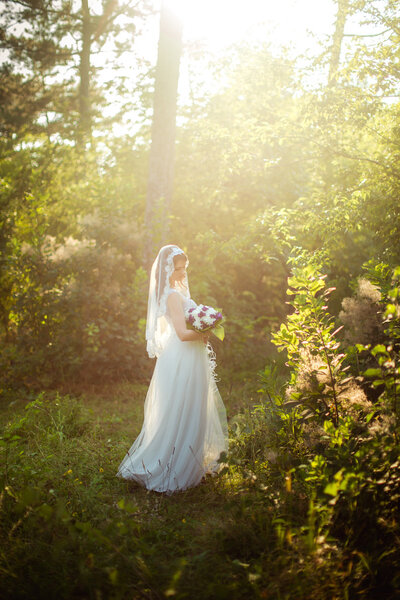 Bride in white dress in the garden