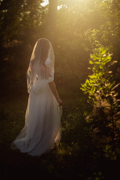 Bride in white dress in the garden