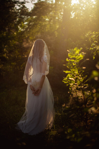 Bride in white dress in the garden