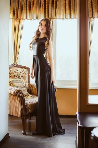 Beautiful woman in the black dress — Stock Photo, Image