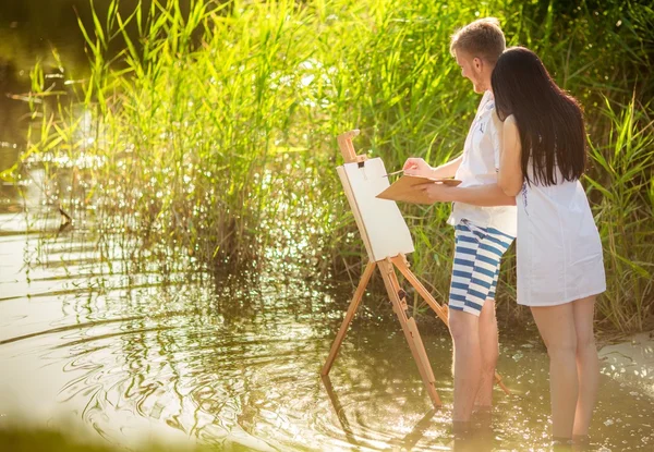 Young couple in love painting — Stock Photo, Image