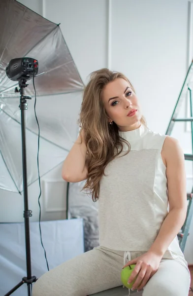 Woman with long hair posing in studio — Stock Photo, Image