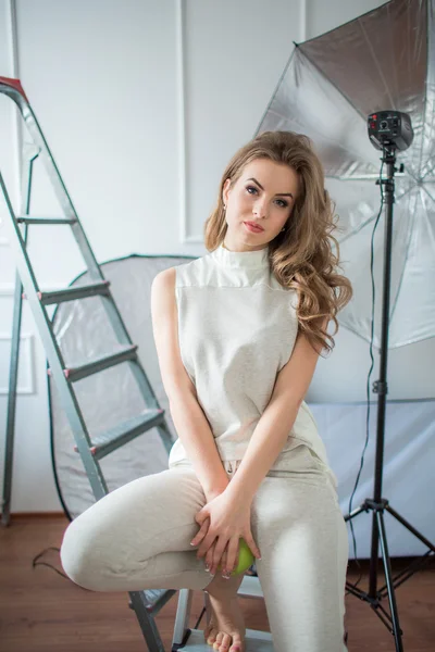 Woman with long hair posing in studio — Stock Photo, Image