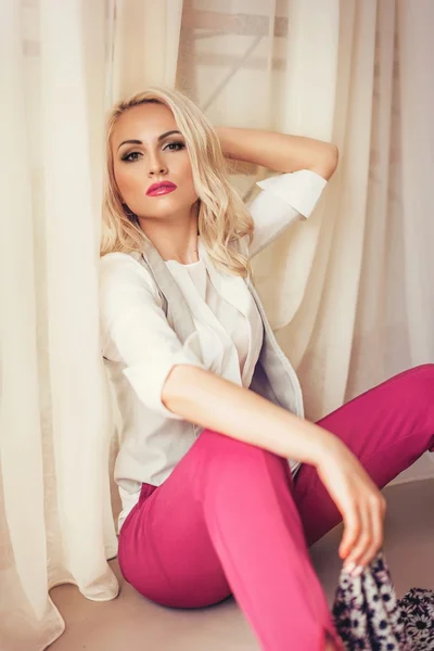 Beautiful blonde woman in fashion clothes — Stock Photo, Image