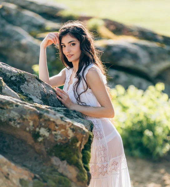 Young woman in white dress outdoors — Stock Photo, Image