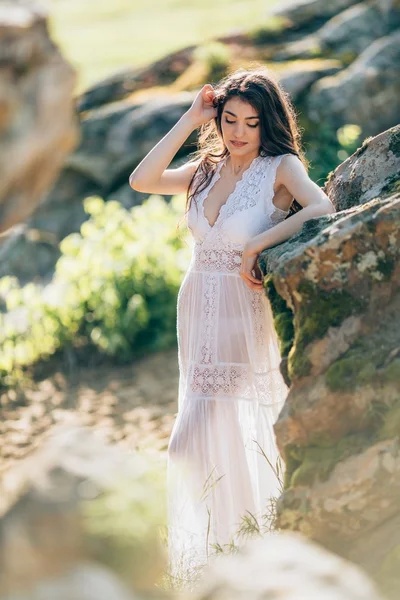 Young woman in white dress outdoors — Stock Photo, Image