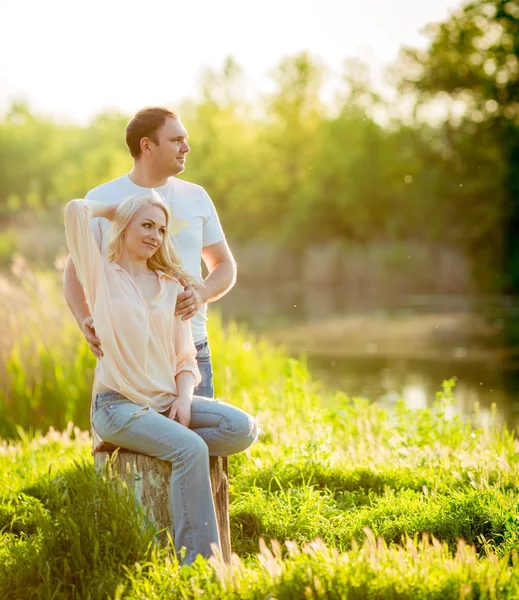 Young couple  on park lawn — Stock Photo, Image