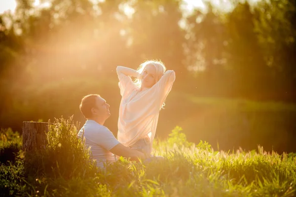 Young couple  on park lawn — Stock Photo, Image