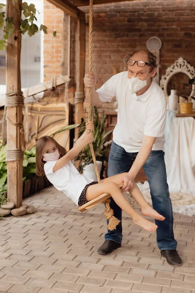 Little Granddaughter Face Mask Hugs Wants Protect Grandfather Epidemic Family — Stock Photo, Image