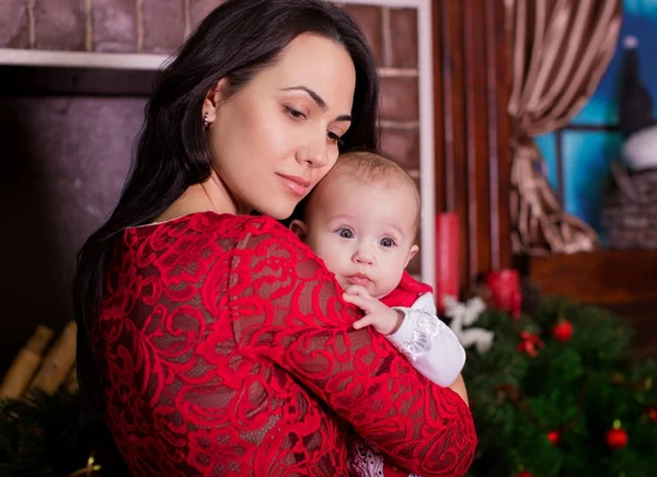 Mother and daughter over Christmas tree — Stock Photo, Image