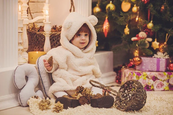 Girl near a Christmas tree with gifts — Stock Photo, Image