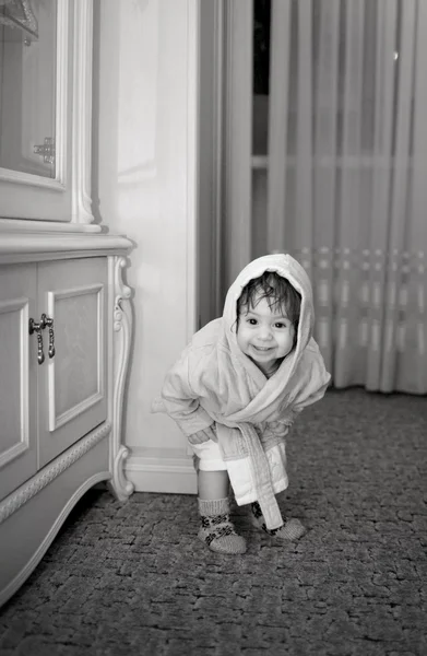 Baby girl in a plush bathrobe — Stock Photo, Image