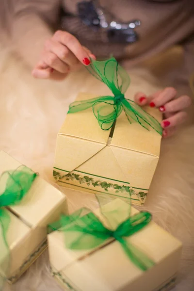 Hands are opened out by boxes with gifts — Stock Photo, Image