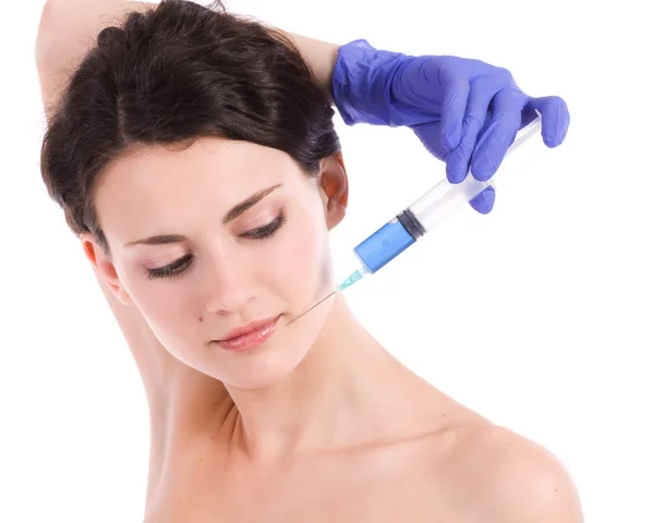 Mujer recibe una inyección en su cara — Foto de Stock