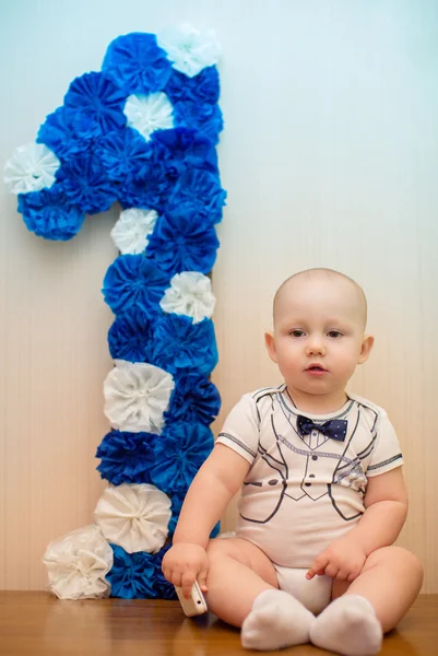 Boy  with a number one — Stock Photo, Image