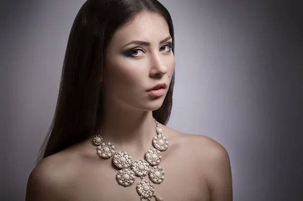 Woman with makeup and modern necklace — Stock Photo, Image