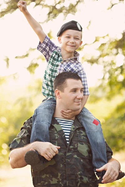 Boy and soldier in a military uniform — Stock Photo, Image