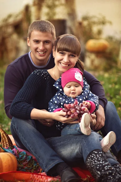 Pretty family in autumn park — Stock Photo, Image