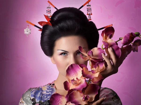 Japanese geisha woman with orchid — Stock Photo, Image