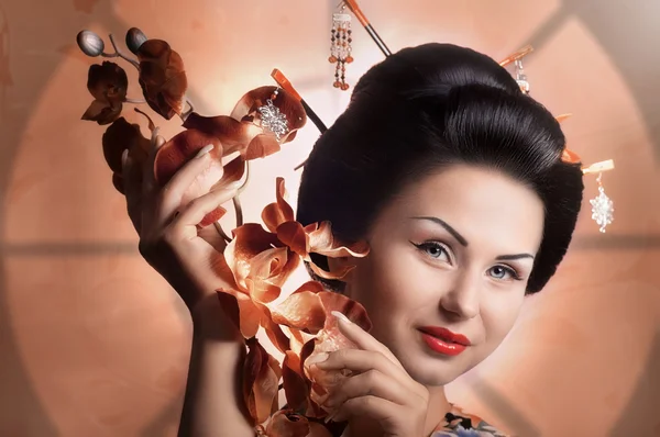 Geisha japonesa mujer con orquídea —  Fotos de Stock