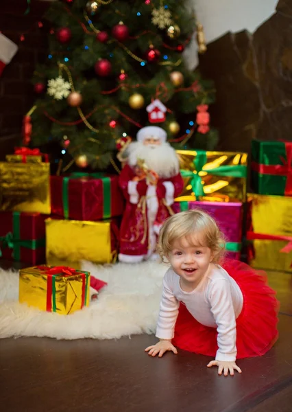 Little girl with Christmas gifts — Stock Photo, Image