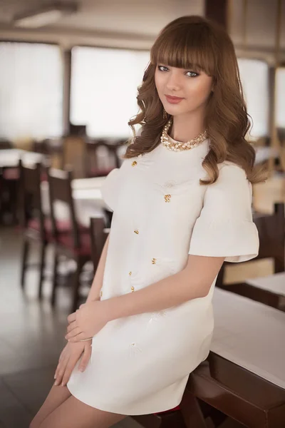 Beautiful young girl in white dress — Stock Photo, Image