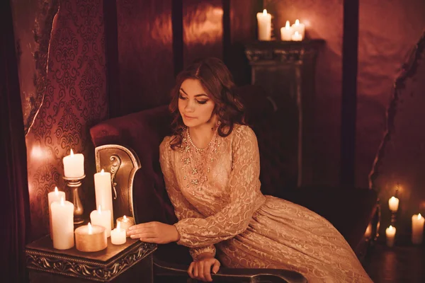 Young woman with candles — Stock Photo, Image