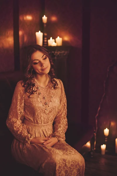 Young woman with candles — Stock Photo, Image