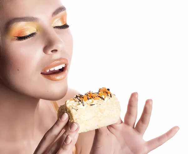 Fashion girl with delicious orange praline — Stock Photo, Image