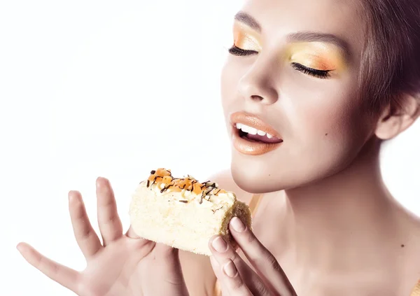 Fashion girl with delicious orange praline — Stock Photo, Image