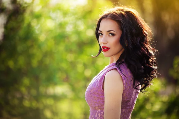 Woman in violet dress outdoors — Stock Photo, Image