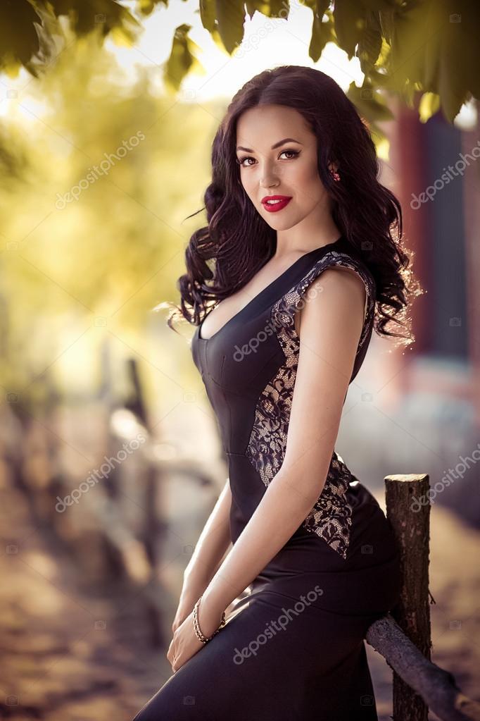 Woman in black dress outdoors Stock Photo by ©Forewer 74955071