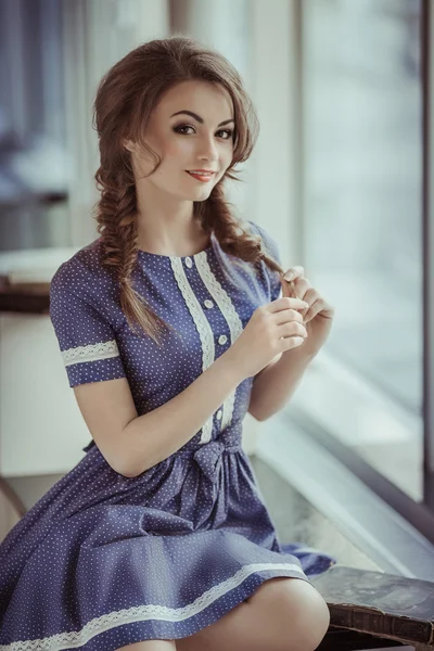 Woman studying near the window — Stock Photo, Image