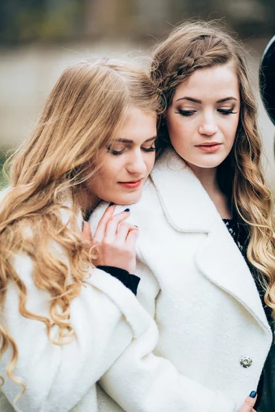 Beautiful girls in white coats — Stock Photo, Image