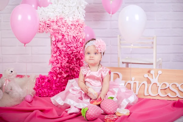 Princess baby girl with donuts — Stock Photo, Image