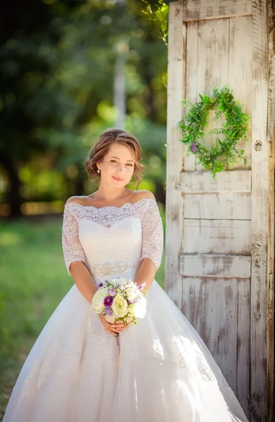 Beautiful romantic bride in park — Stock Photo, Image