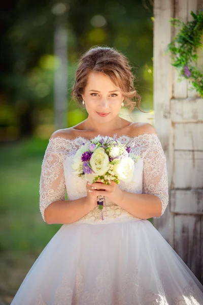 Beautiful romantic bride in park — Stock Photo, Image