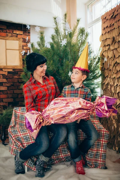 Mother and son at Christmas eve — Stock Photo, Image