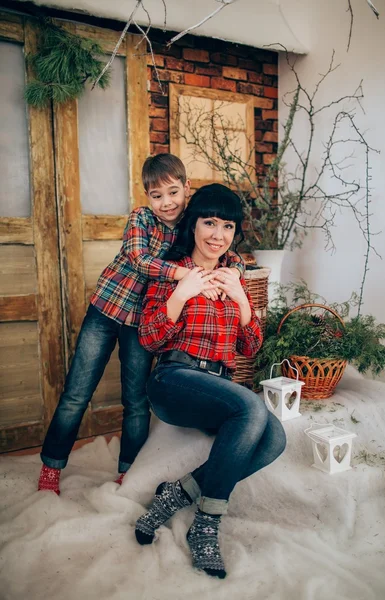 Mother and son at Christmas eve — Stock Photo, Image