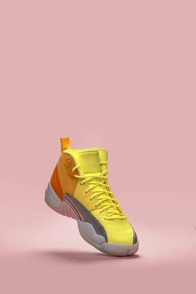 Air Jordan 12 Retro flying sneaker isolated on the pink background — Stock Photo, Image