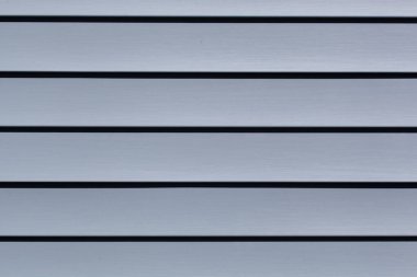 Mavi inşaat vinil kaplama panelleri. Plastik kaplamalı ev. Yatay çizgileri olan vinil kaplama yüzeyi