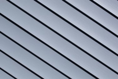 Mavi inşaat vinil kaplama panelleri. Plastik kaplamalı ev. Yatay çizgileri olan vinil kaplama yüzeyi