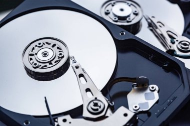 An open computer hard drives for repair. HDD. Components for ps. Storage and restoration of digital data