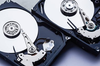 An open computer hard drives for repair. HDD. Components for ps. Storage and restoration of digital data
