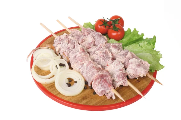 Three skewers of raw kebabs Stock Image