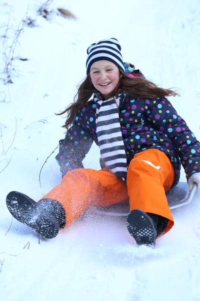 Teen girl sledding — Stock Photo, Image